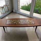 Coffee table with decorative tile.