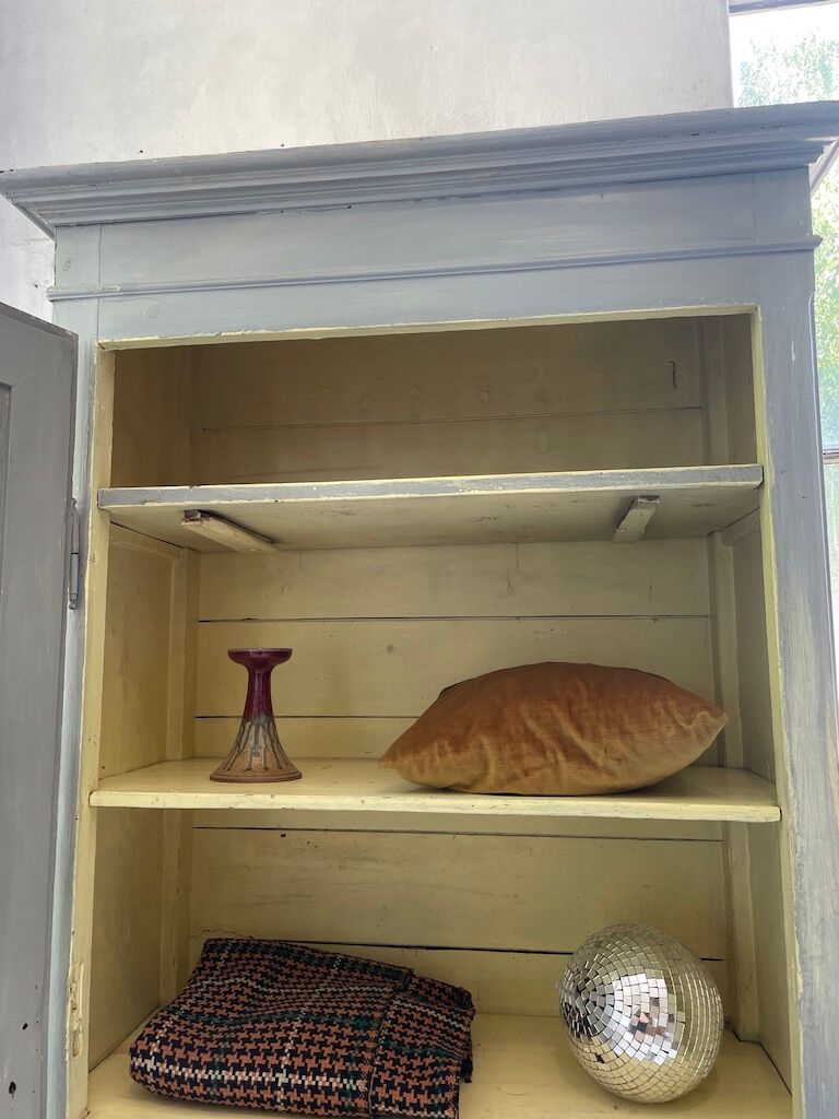 Blue patinated cap cabinet