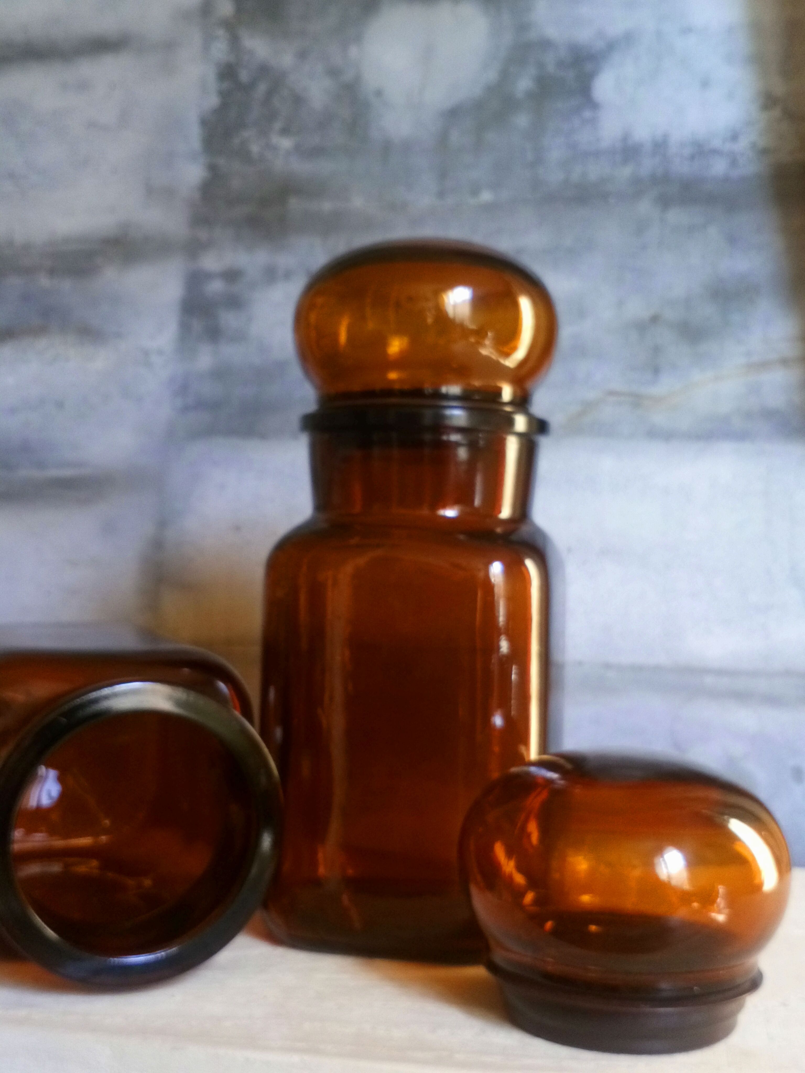 Duo of vintage apothecary bottles in amber glass