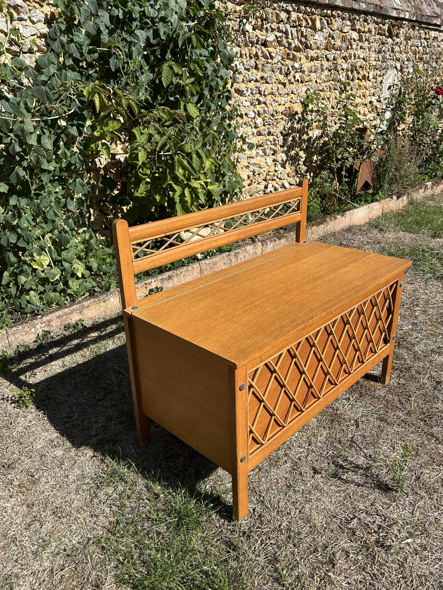 Vintage 1960s bank chest in light oak and rattan weaving.