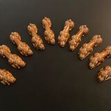 10 ceramic knife holders in the shape of a recumbent poodle