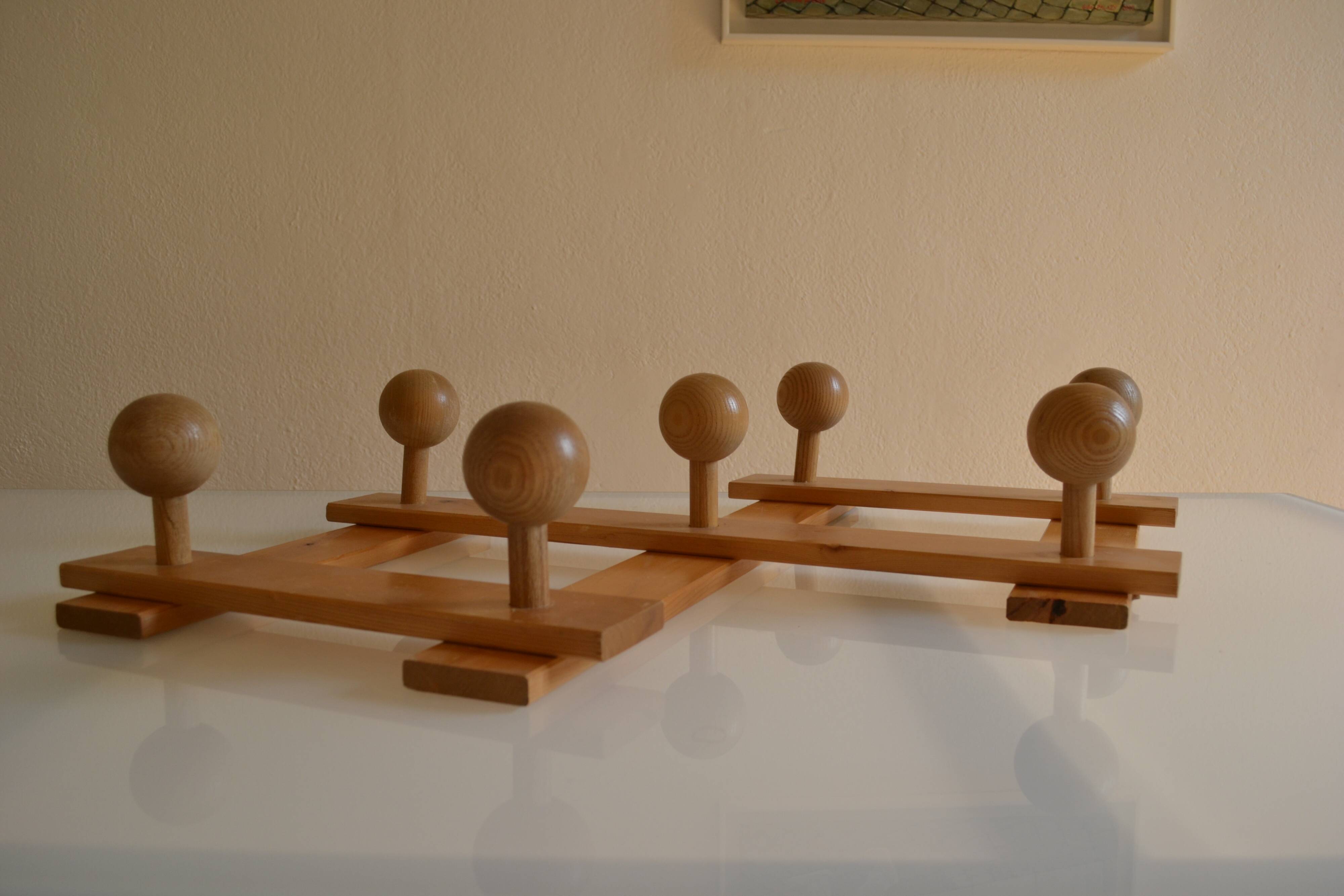 Brutalist wooden accordion wall coat rack with 7 hooks