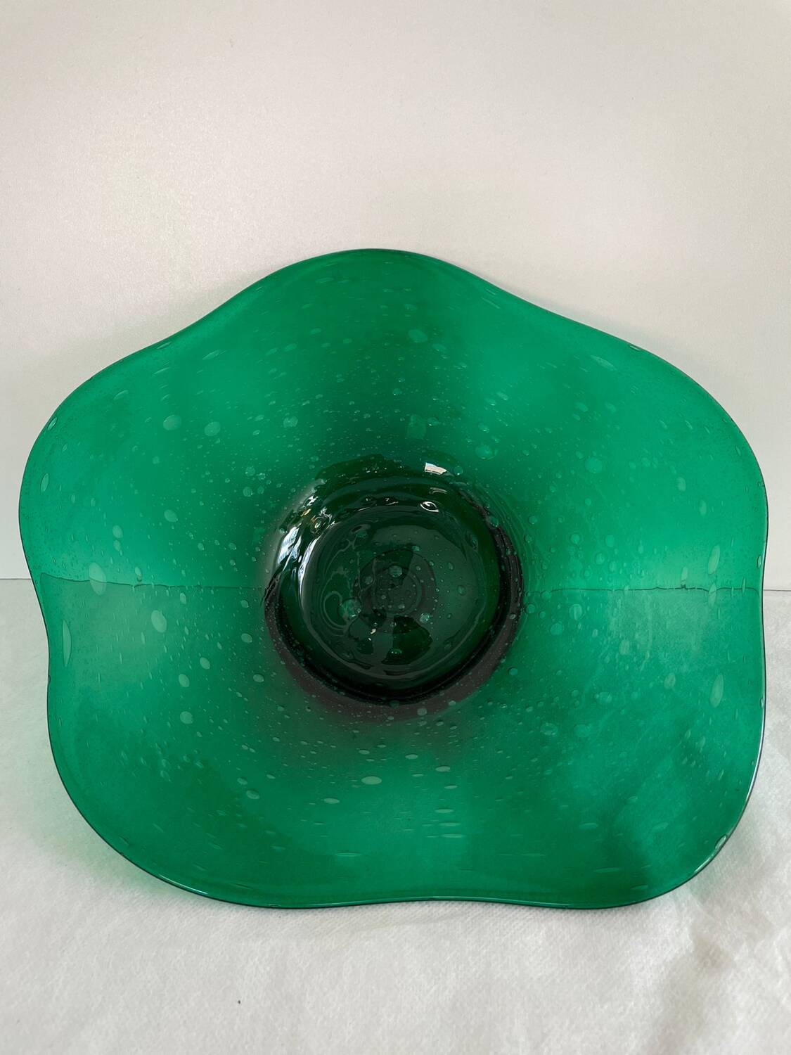 Green glass dish by Max Verboeket