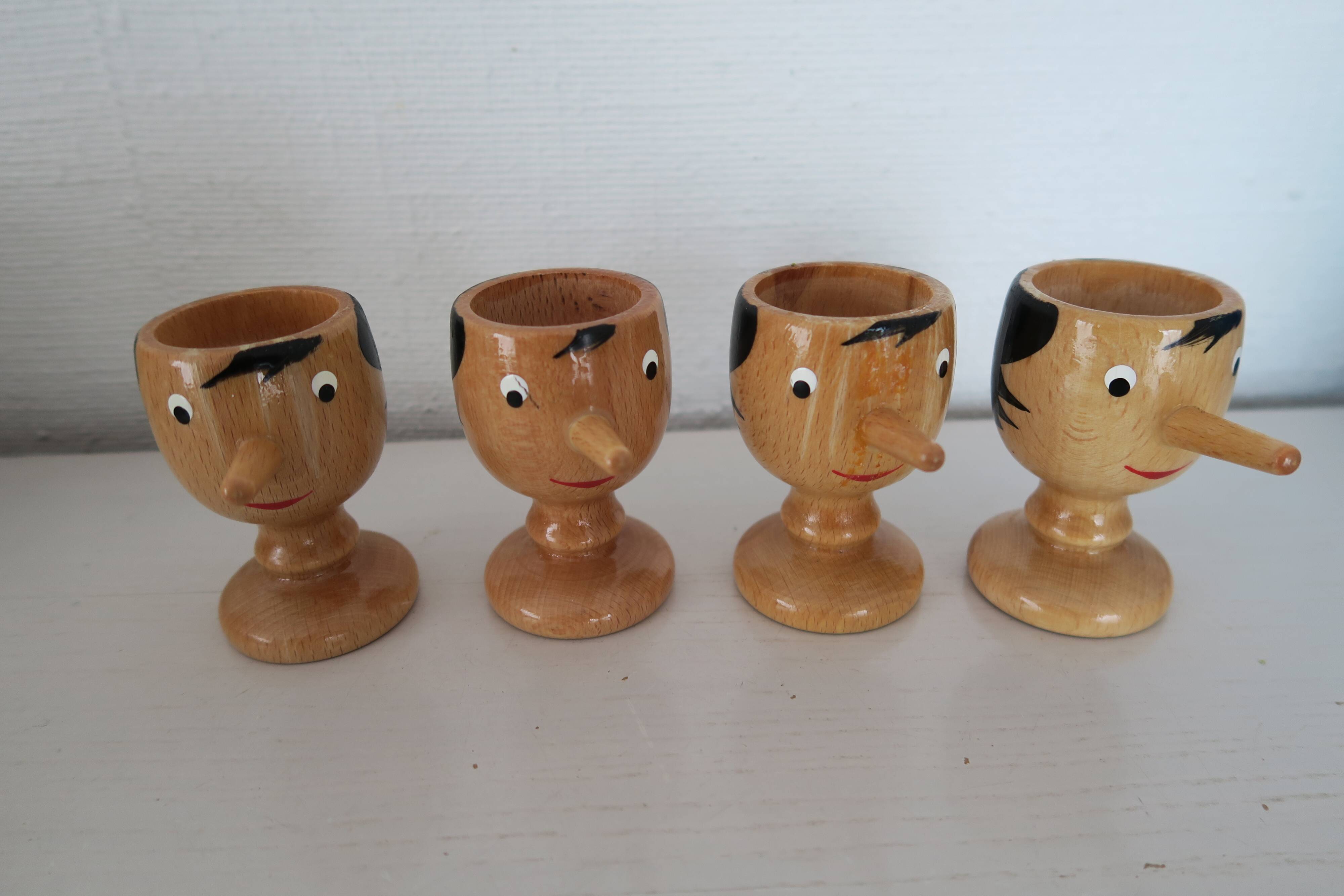 4 Pinocchio wooden egg cups Italy New