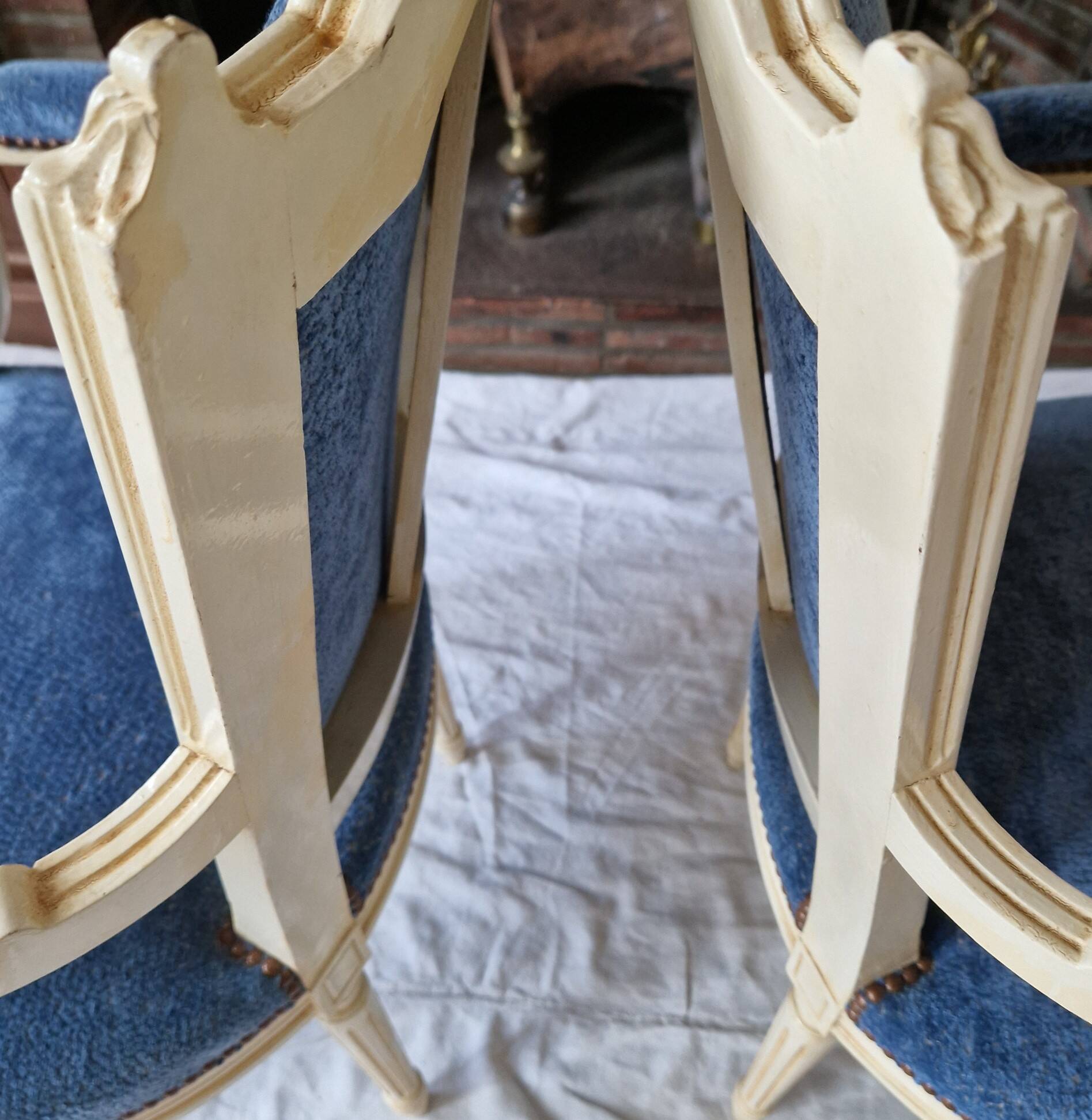 Pair of Louis XVI cabriolet armchairs in cream and blue French elegance late 19th century