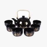 Japanese tea service, teapot and 6 cups, black, gold pattern.
