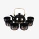 Japanese tea service, teapot and 6 cups, black, gold pattern.