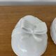 Pair of porcelain egg-shaped pocket trays