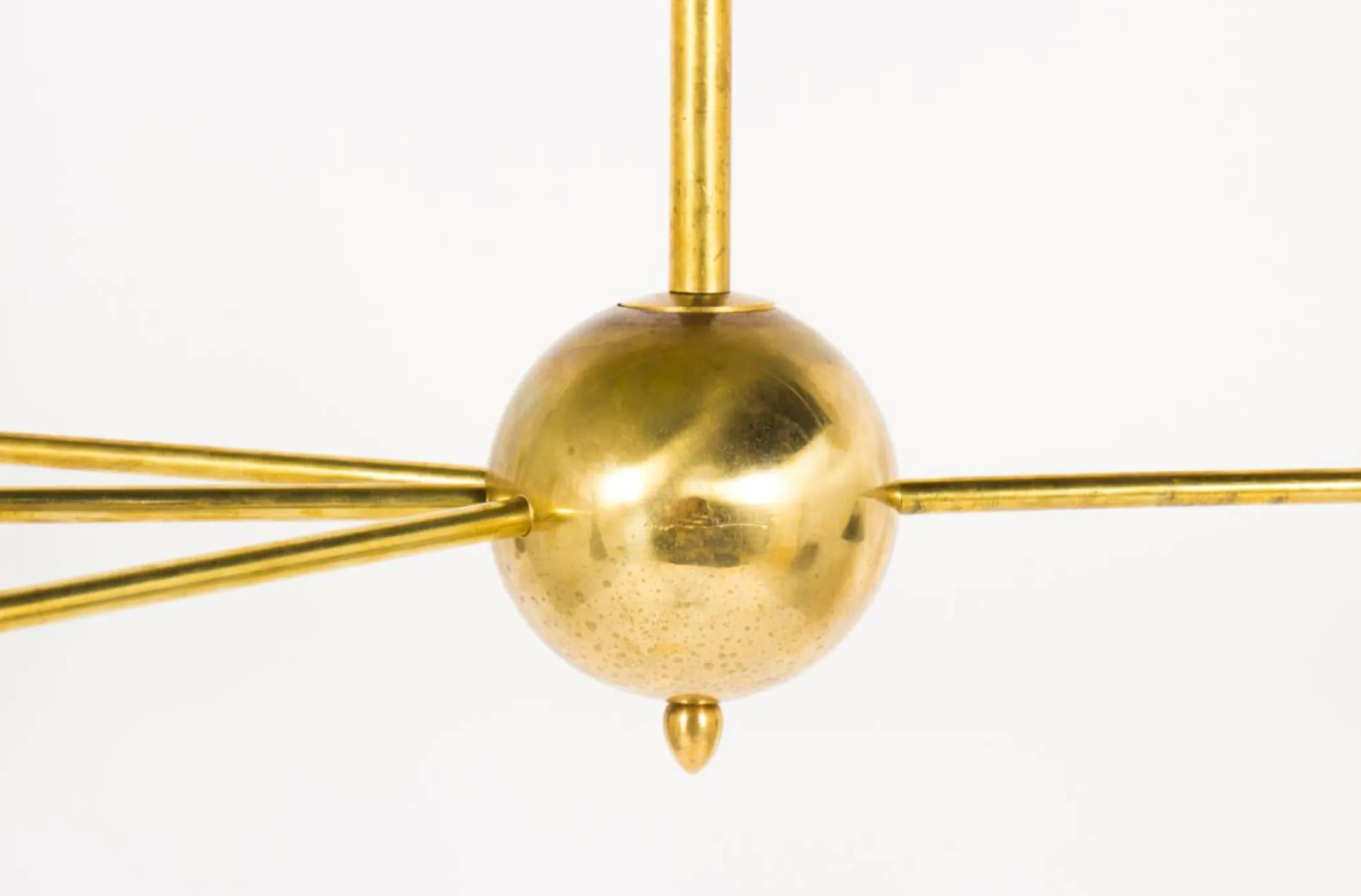 8-light brass chandelier and white-black and gold day blinds