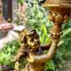 Pair of large candlesticks with cherubs