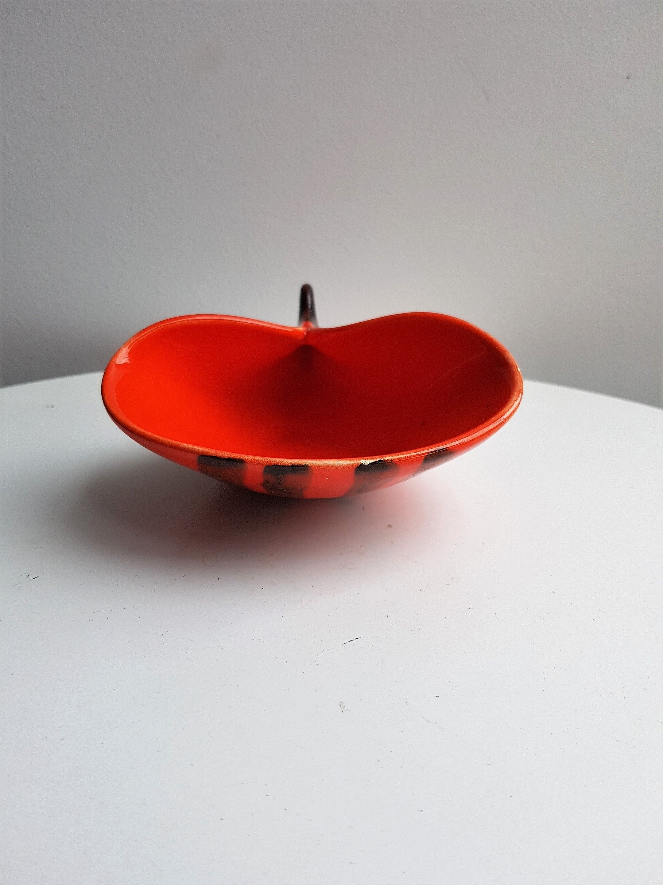 Empty orange enamelled pocket bird years 70