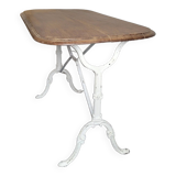 Bistro table with cast iron base and oak top