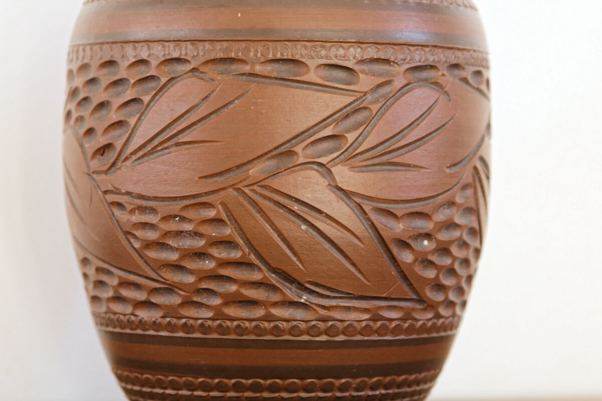 Carved terracotta vase, signed