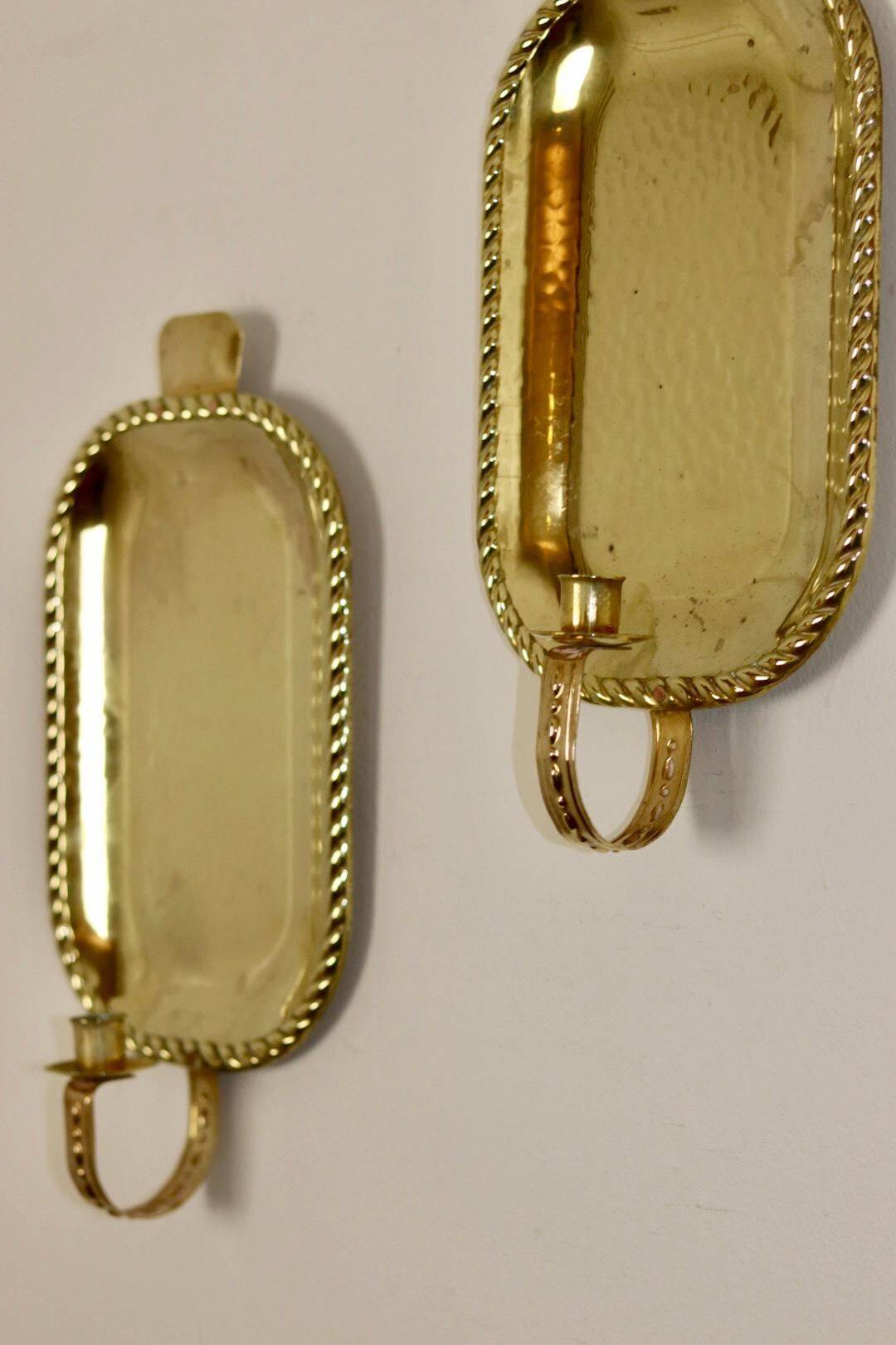 Pair of Swedish brass wall sconces from the mid-century.