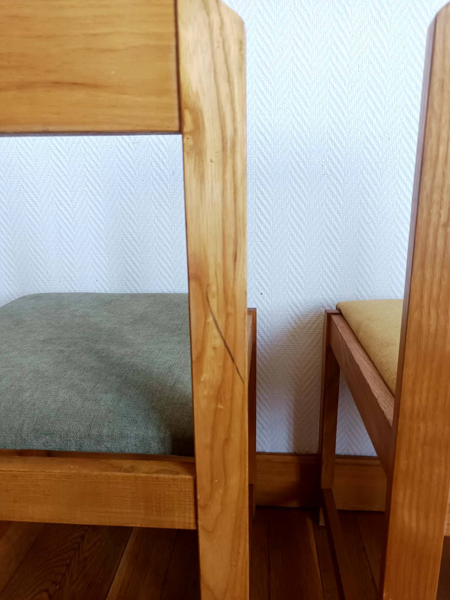 Six Scandinavian style chairs in elm and fabric.