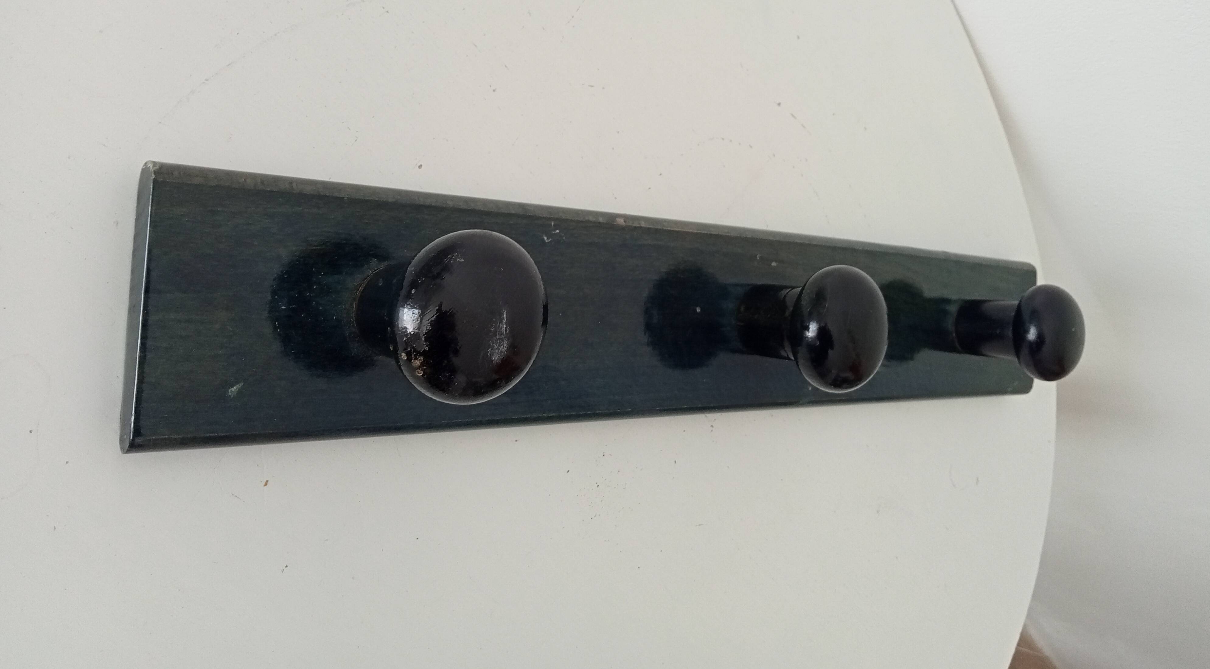 Vintage wall-mounted coat rack in lacquered wood from the 60s