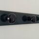 Vintage wall-mounted coat rack in lacquered wood from the 60s