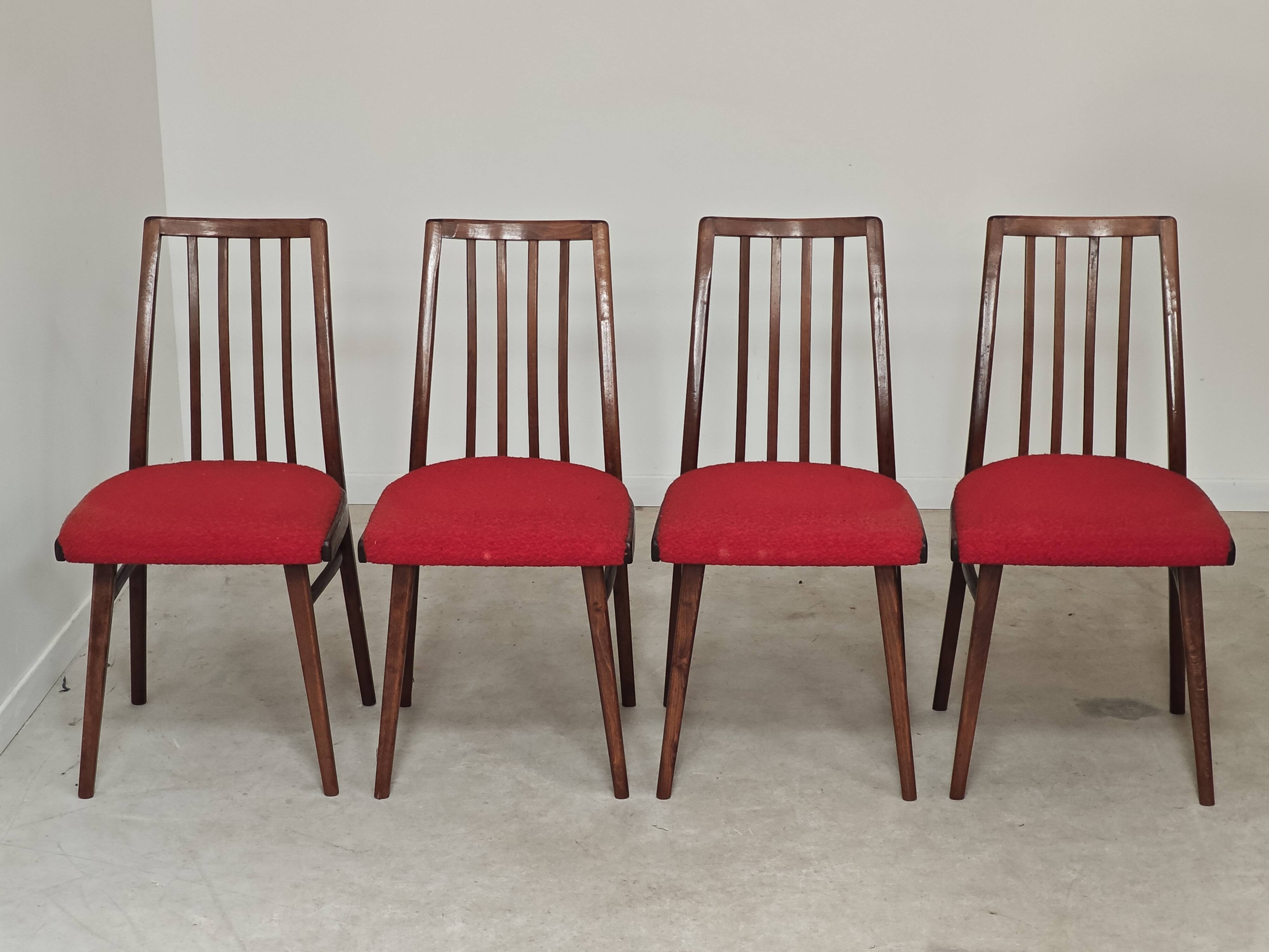 Set of 4 red dining chairs by Antonin Suman for Interier Praha.