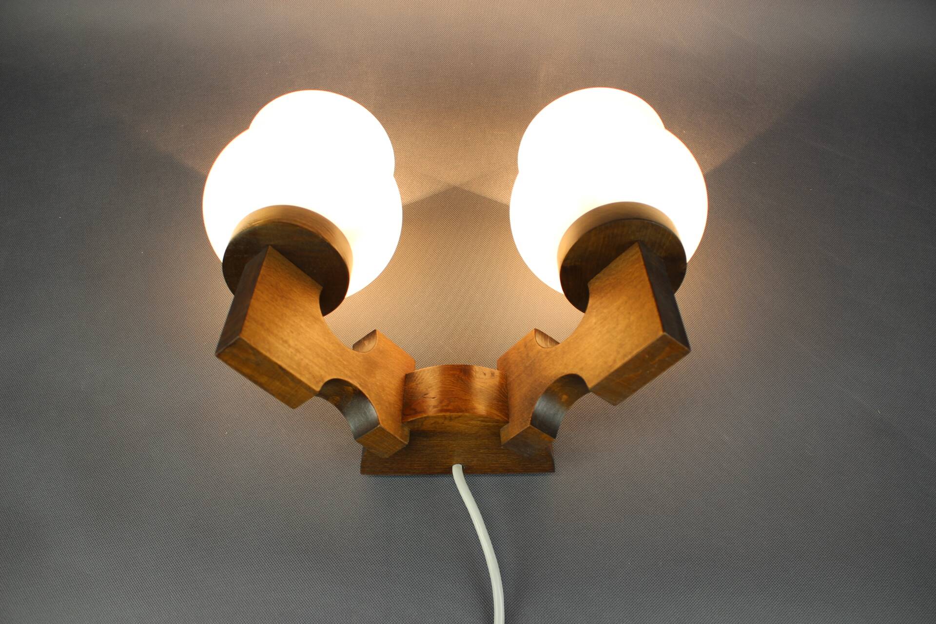 Czechoslovak wall lamp from the 1960s with Valasske Mezirici glass and a wooden base.