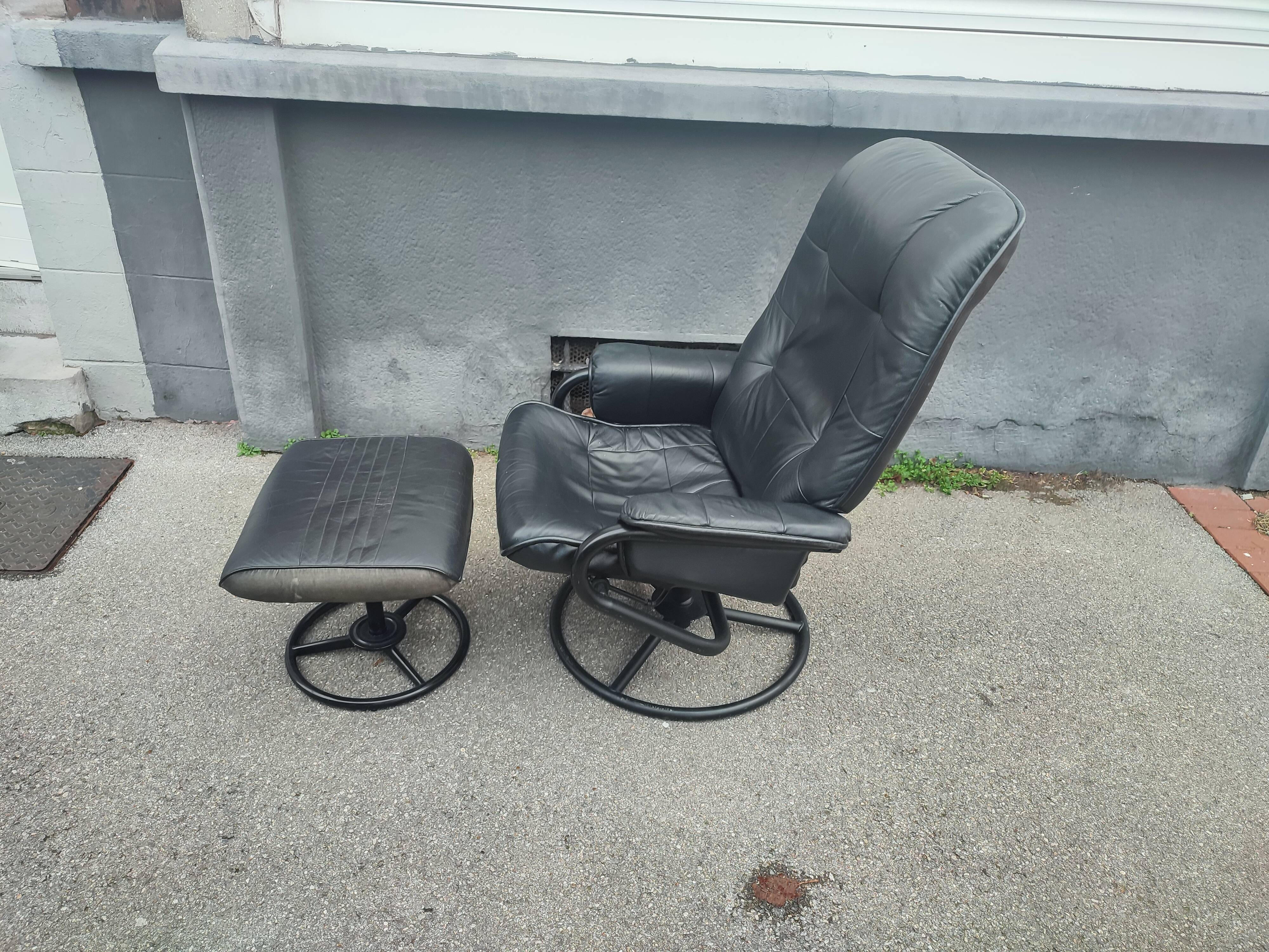 Scandinavian design leather armchair and footrest