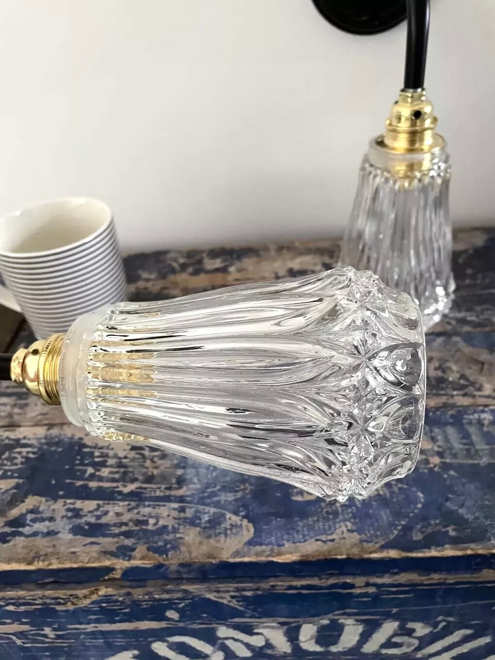 Set of two electrified chiseled glass sconces to nine
