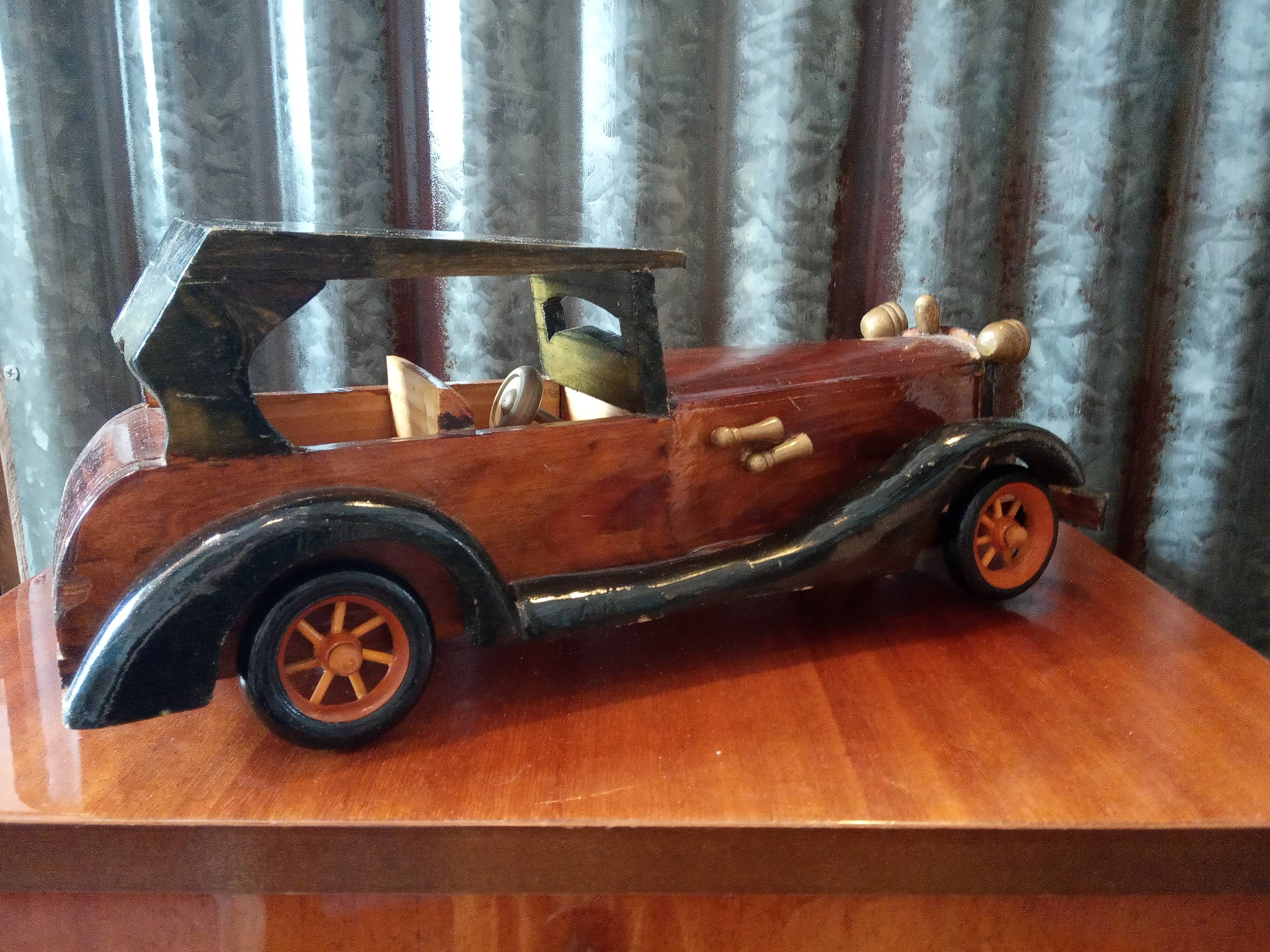 Toy car made of varnished wood