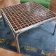 Vintage square coffee table with chrome legs and small tiled squares.