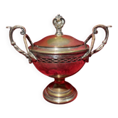 Antique sugar bowl on a stand with a lid and interior lining in velvet.