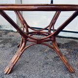 Round rattan and wicker table with glass top