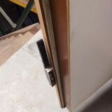 Old fridge behind wooden bar