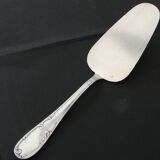 12 cake forks and a silver metal server.