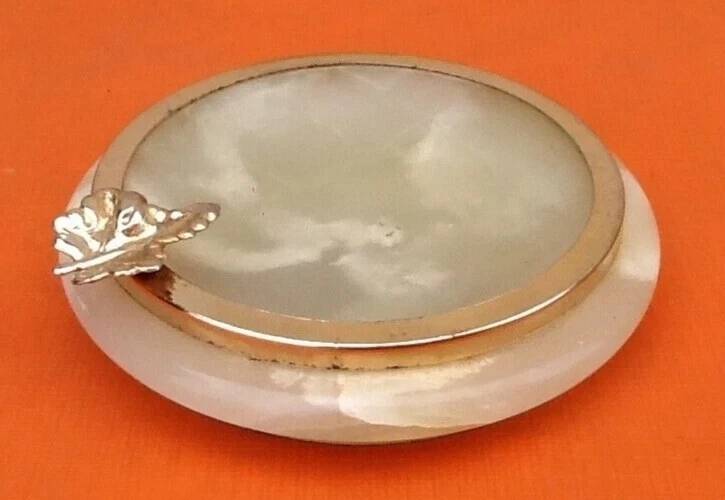 1970s Onyx ashtray with a gold metal rim.