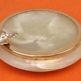 1970s Onyx ashtray with a gold metal rim.