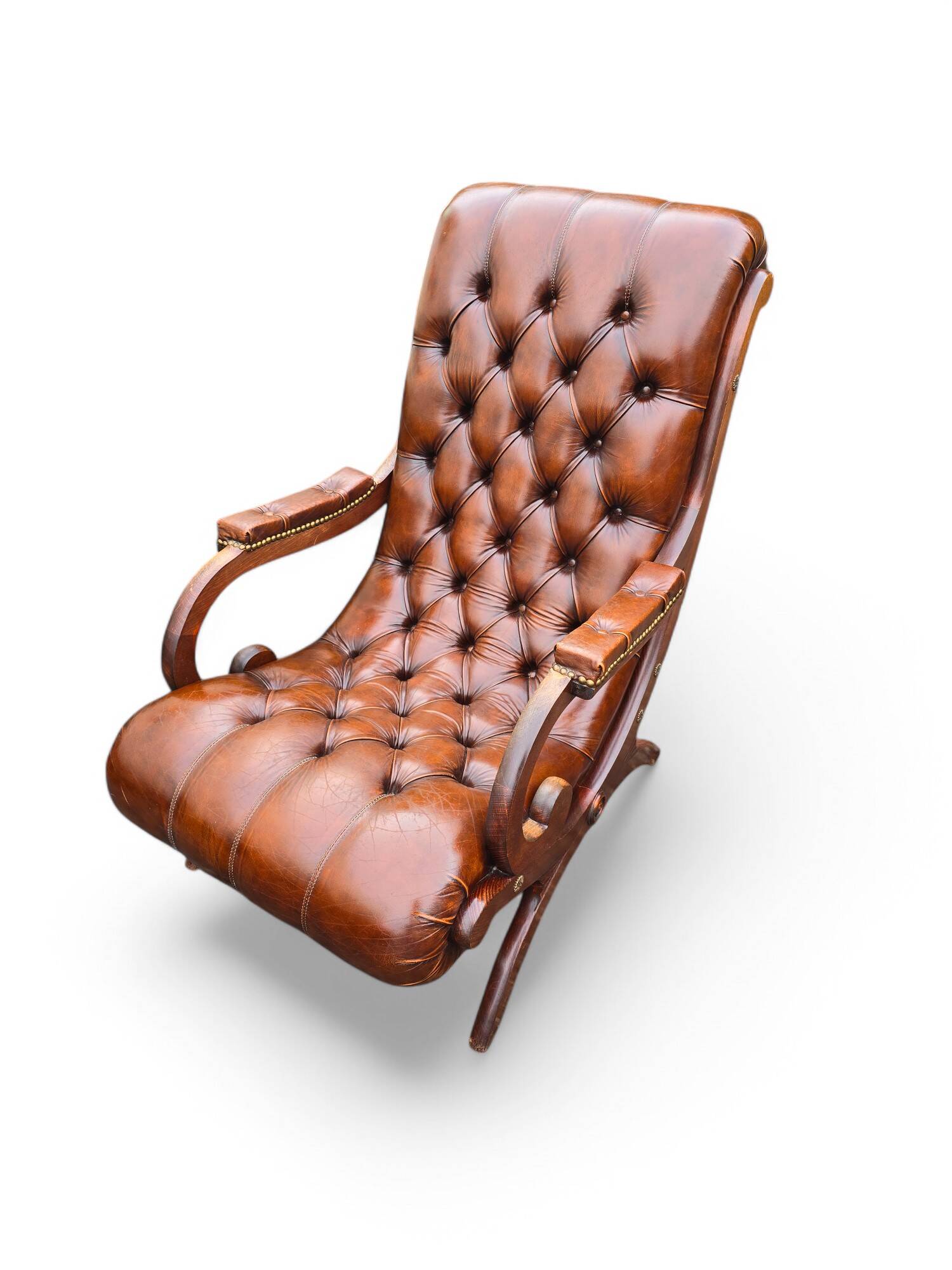 Pair of leather Chesterfields and footstools