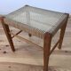 Scandinavian stool from the 1960s with caning and wood.