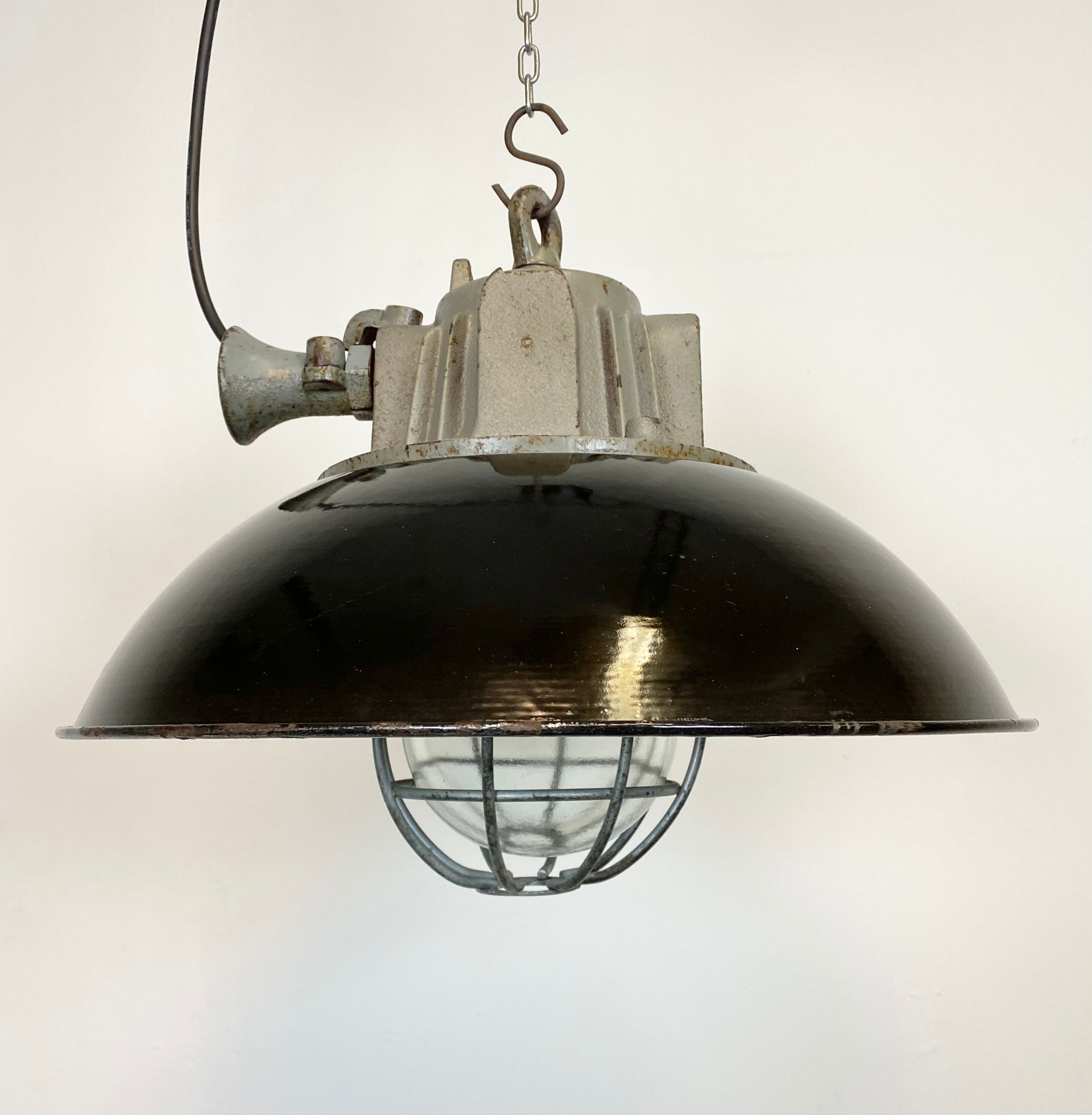 Black enamel and cast iron industrial cage pendant light , 1950s