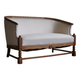 Sculptural 2-seater canapé in oak and wool, Danish "Skønvirke" style, 1920s.