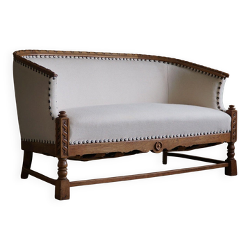 Sculptural 2-seater canapé in oak and wool, Danish "Skønvirke" style, 1920s.