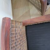 2 colonial-style armchairs in woven rattan and exotic wood