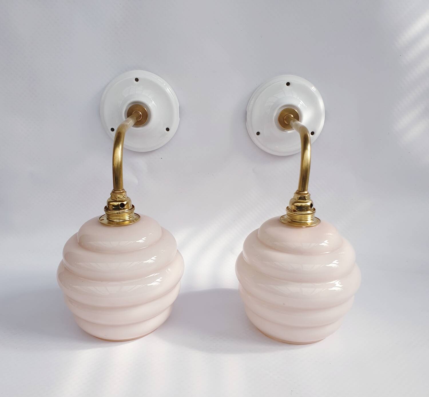 Swan neck and glass globe wall lights