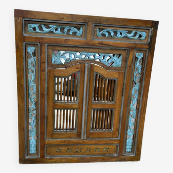 Mirror with carved shutters