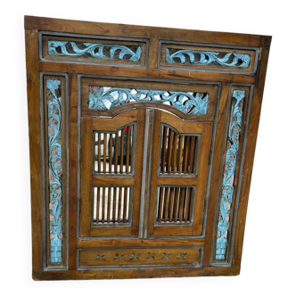 Mirror with carved shutters