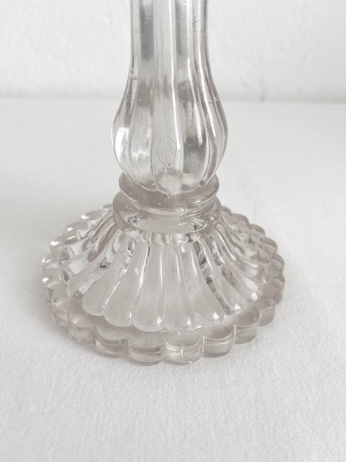 Antique baluster-shaped molded glass candlestick holder