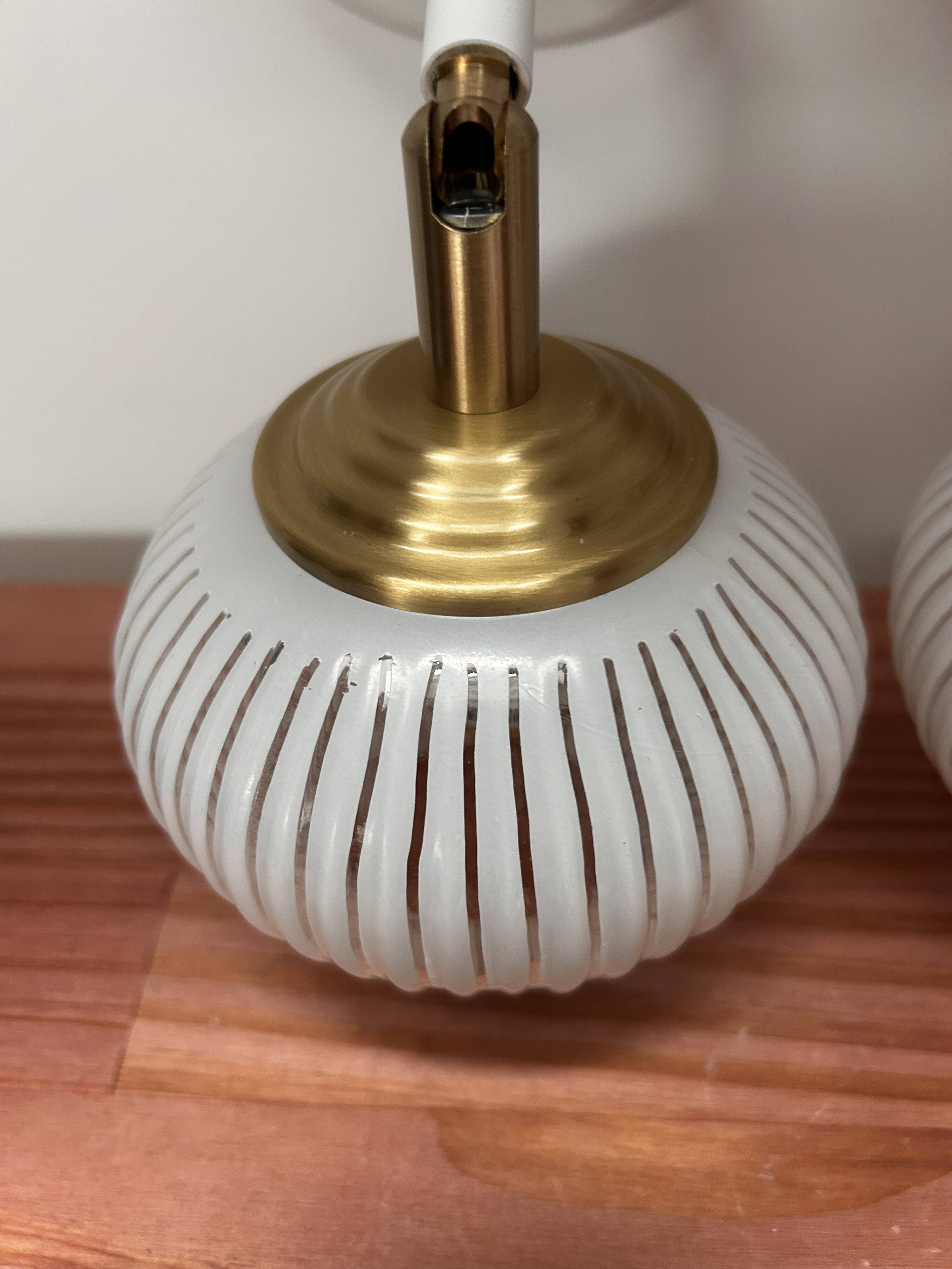 Pair of vintage white globe tilting wall sconces