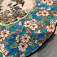 Longwy enamel plate with cartouche of 2 birds and apple blossoms, d188