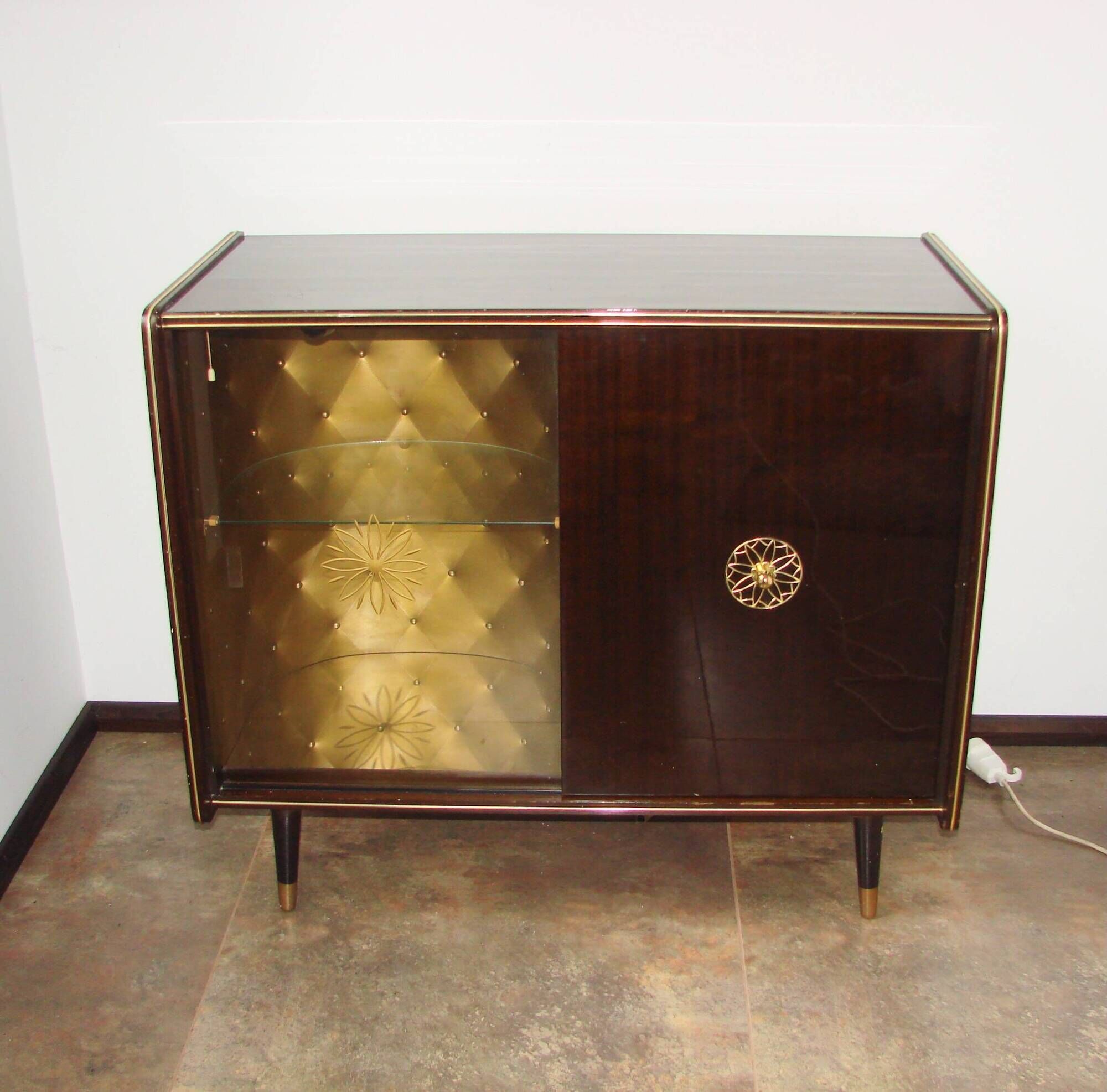 A vintage cabinet with a record player and a bar, 1960s.