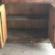 Vintage brown pine dresser with a painted top, moulded panels, and decorative locks.