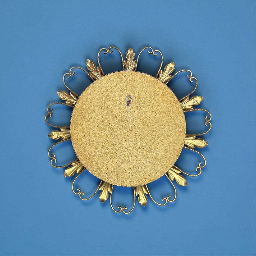 Circular gold metal mirror with floral decoration – 1960s