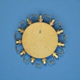 Circular gold metal mirror with floral decoration – 1960s