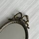 Petit miroir oval ancien